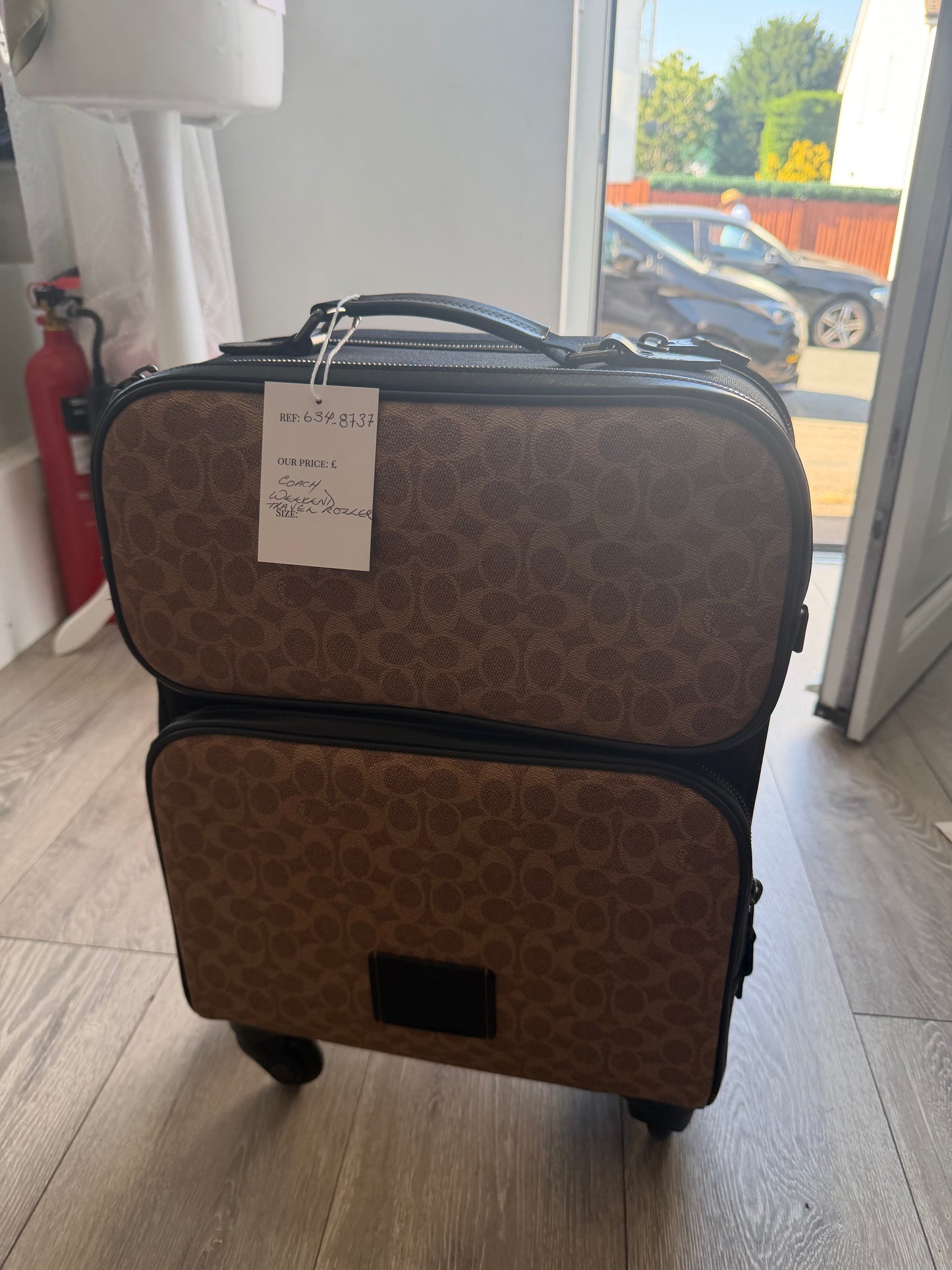 Preloved black and tan Coach Luggage, Medium